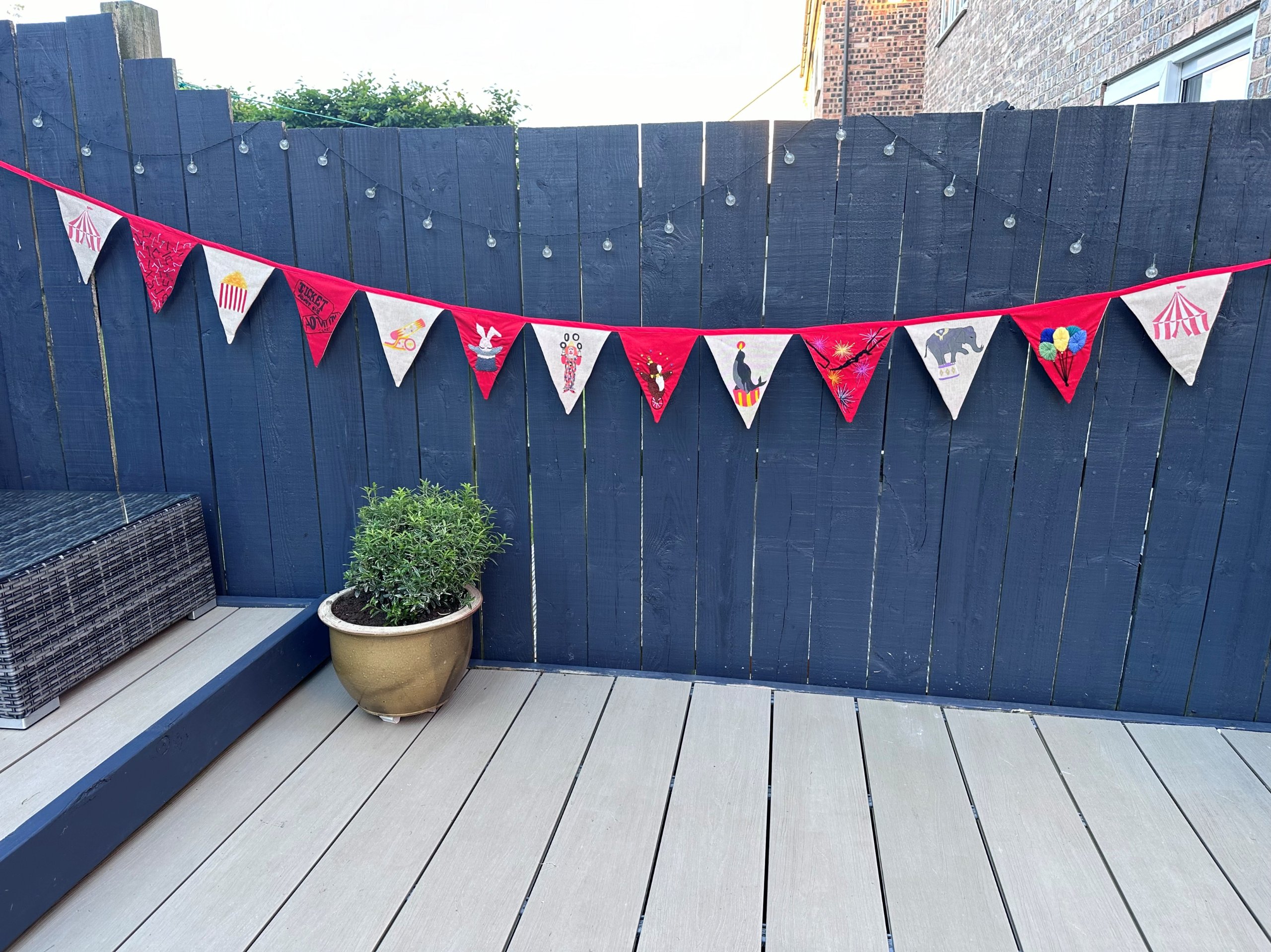 The finished bunting strung along a fence