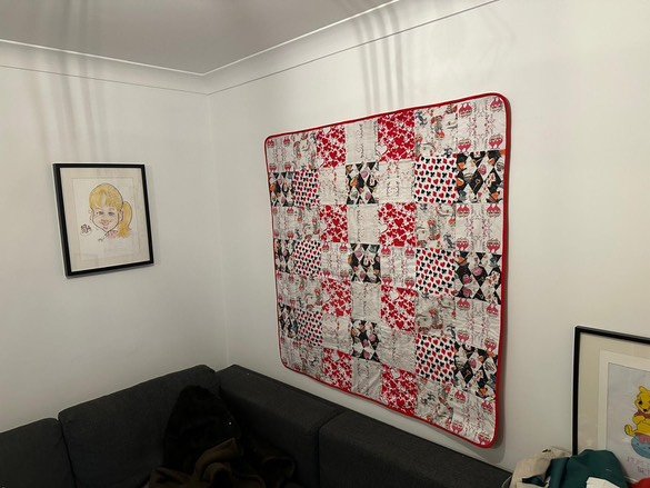 The quilt displayed as wall art