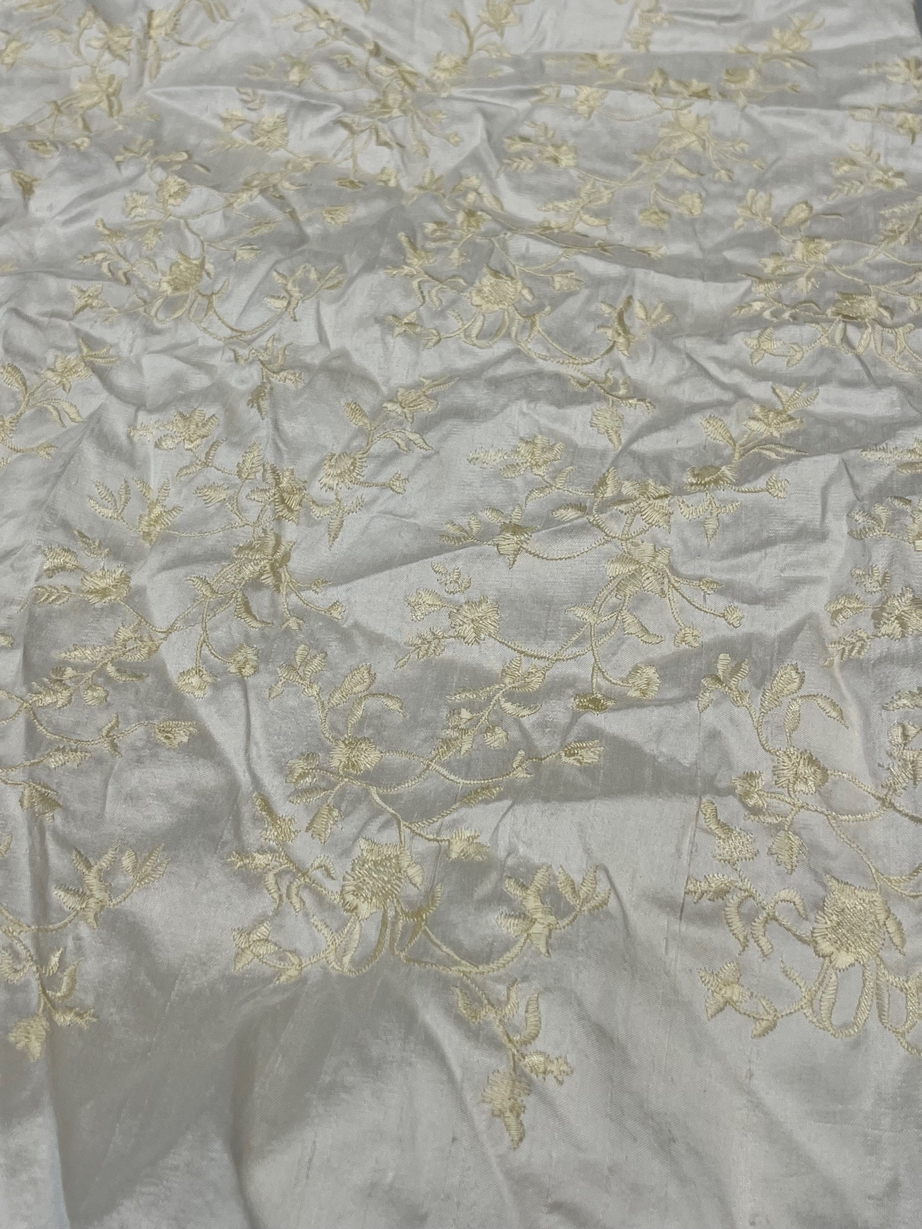 Gold floral on grey fabric